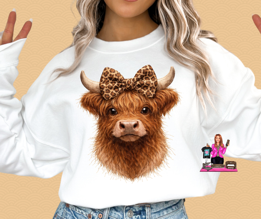 BROWN HIGHLAND WEARING LEOPARD BOW